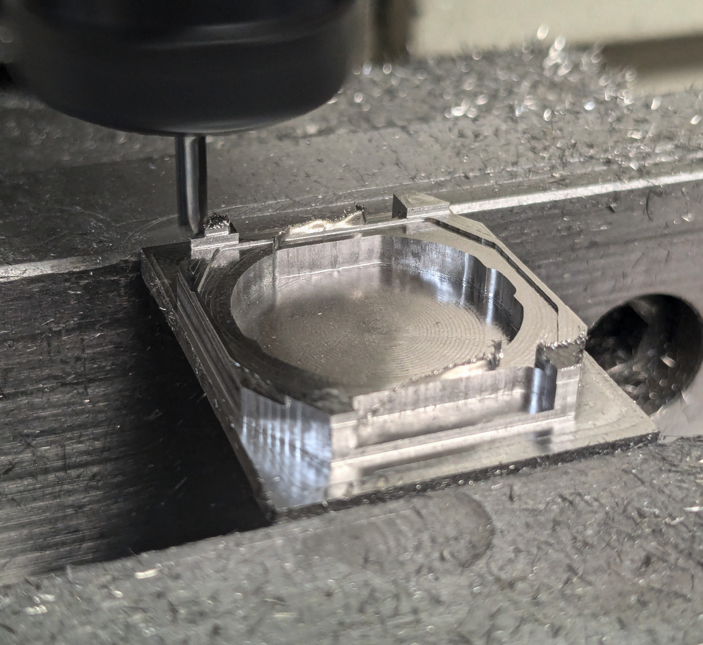 CNC milling the watch case showing precision manufacturing process