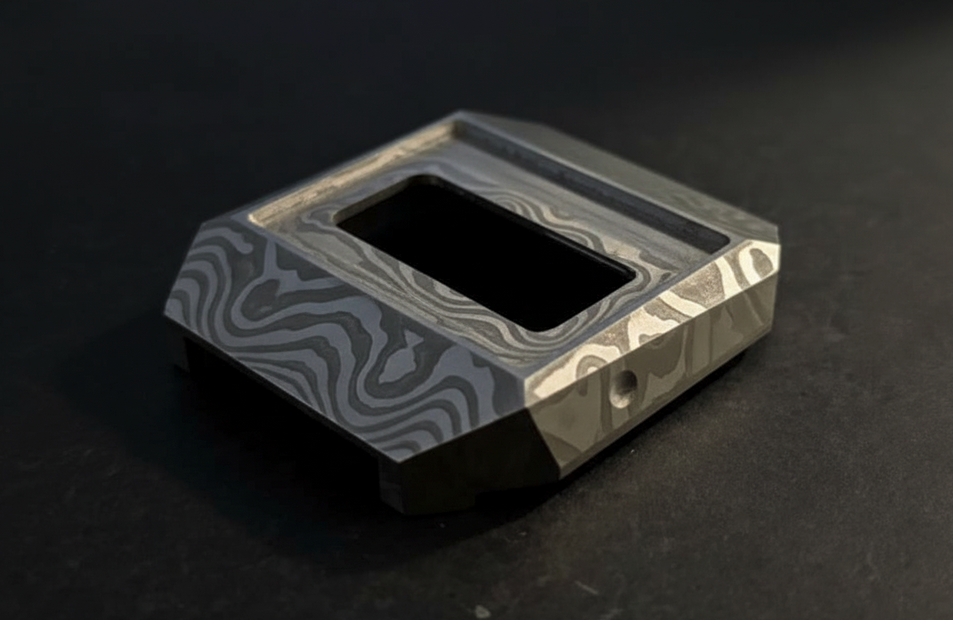 Close-up of damascus steel pattern showing flowing organic layers